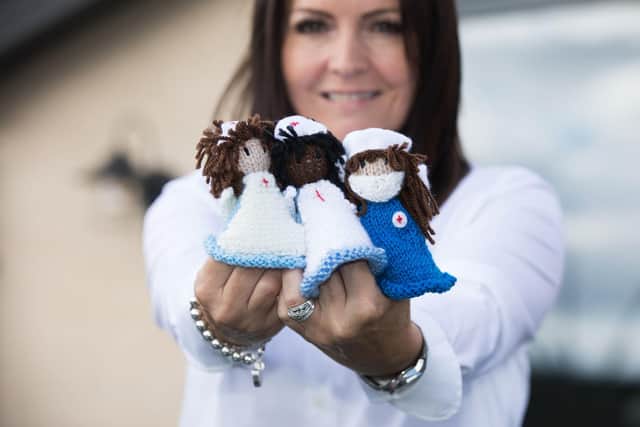 Debbie Goolding with some of the little angel mascots she knitted to spread joy for frontline workers. Picture: Chris Ratcliffe/National Lottery/PA Wire