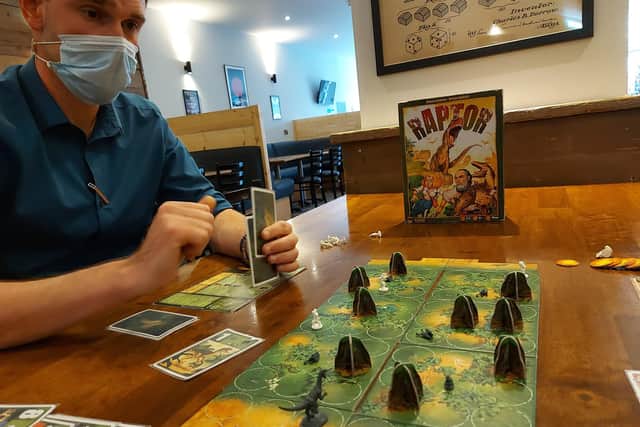 Julian Hood, general manager of Dice gaming cafe in Albert Road, Southsea, plays Raptor with staff member Henry Marks (out of shot). Picture by Chris Broom