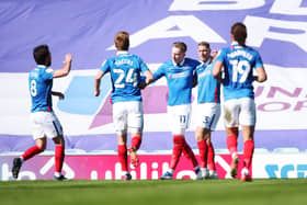 Ronan Curtis celebrates with his Pompey team-mates after scoring in the 2-1 victory over Rochdale. Picture: Joe Pepler