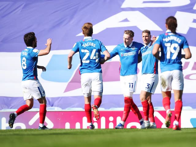 Ronan Curtis celebrates with his Pompey team-mates after scoring in the 2-1 victory over Rochdale. Picture: Joe Pepler