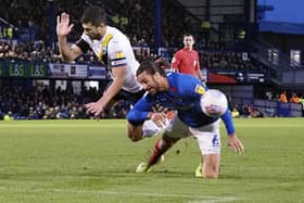 Oxford's John Mousinho battles with Christian Burgess for the ball in a 1-1 draw at Fratton Park in November 2019. Picture: Barry Zee