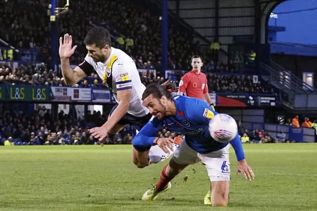Oxford's John Mousinho battles with Christian Burgess for the ball in a 1-1 draw at Fratton Park in November 2019. Picture: Barry Zee