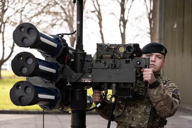 A Gunner from 170 Battery, 12 Regiment Royal Artillery stands with the High Velocity Missile (HVM) Lightweight Multiple Launcher (LML) during a demonstration held at Baker Barracks on Thorney Island.