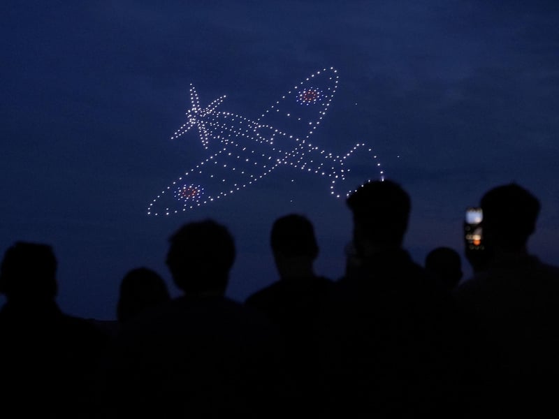 Drones make a Spitfire during a drone display telling the story of D-Day. Photo: Andrew Matthews/PA Wire