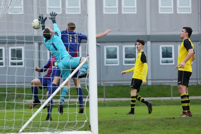 Flo Vucaj (partly hidden) scores for  US Portsmouth. Picture: Chris Moorhouse