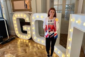 Paralympic hero Lauren Steadman displays the Gold medal she won in the PTS5 triathlon event at the Tokyo games last year.