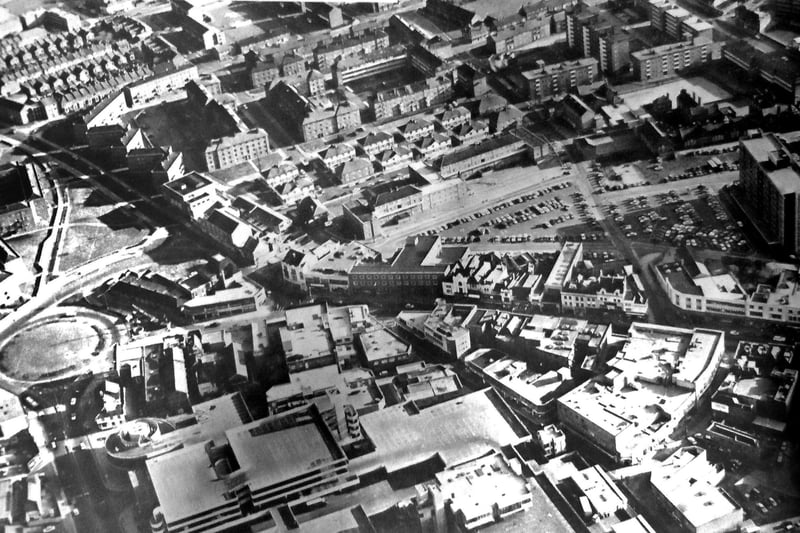 Landscape - This aerial picture is an opportunity to see a selection of the various styles of architecture to be found in the heart of Portsmouth in 1970. In the foreground is the Tricorn and behind it the diverse styling of the shops and stores in Commercial Road. The gabled roofs of the Victorian houses left, can be contrasted with the sloping roofs of the blocks of flats, centre