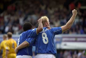 Robert Prosinecki and Kevin Harper celebrate after Pompey's last-gasp win over Gillingham in September 2001