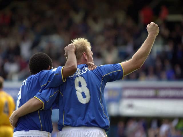 Robert Prosinecki and Kevin Harper celebrate after Pompey's last-gasp win over Gillingham in September 2001
