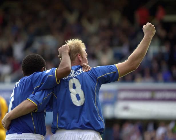 Robert Prosinecki and Kevin Harper celebrate after Pompey's last-gasp win over Gillingham in September 2001