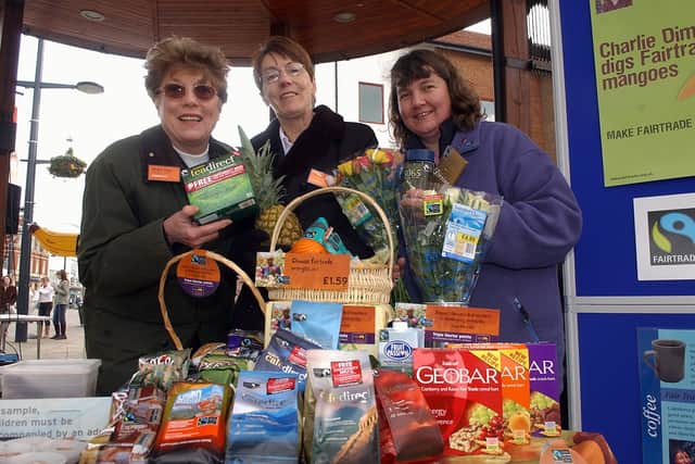 Rachel Hicks, right, from the Fareham Fairtrade Working Group, shows a variety of Fair Trade products with Sue Thomasson, centre, and Sandra Villier from Sainsburys in West Street in March 2006