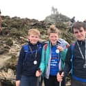From left, Charlie (12), Connie (15) and Jack (14) Threadingham with their Three Peaks Challenge medals.