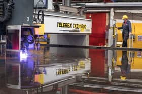 Steelcutter Alex Clark operating the laser cutter on the last section of Glasgow. 
Photo: John Linton Photography
