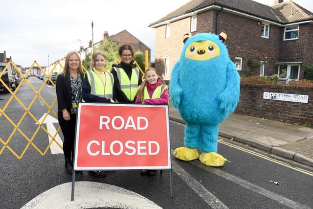 From left, assistant headteacher Sarah Boister, Jessica Bull, 10, Rachel Carlyle, headteacher of King's Academy College Park, Billie Harris, 10, and Stomper the school streets Portsmouth mascot.