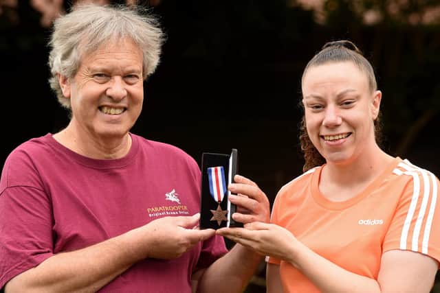Pictured: Left/right:  Sidney's great nephew Chris Cornell and Sidney's granddaughter Penny Cornell with the medal
Photo: Simon Czapp/Solent News