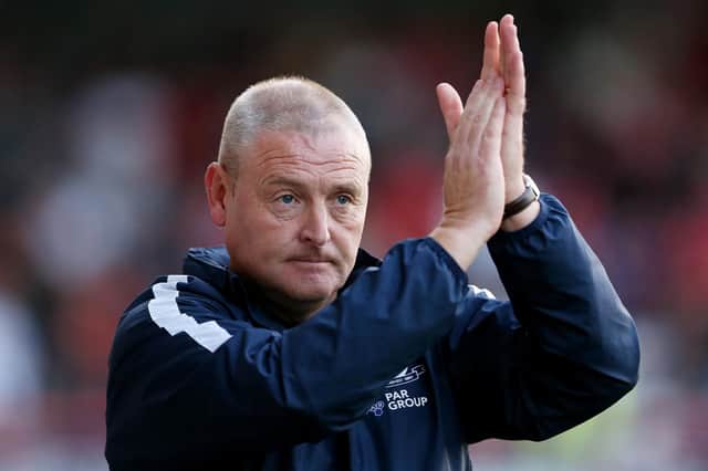 MORECAMBE, ENGLAND - AUGUST 24: Frankie McAvoy, Manager of Preston North End applauds the fans prior to the Carabao Cup Second Round match between Morecambe and Preston North End at Globe Arena on August 24, 2021 in Morecambe, England. (Photo by Charlotte Tattersall/Getty Images)