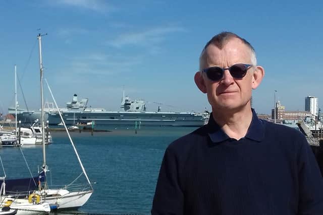 Neil Sutton, who has lived with his family in Flagstaff Green on the old Royal Clarence Yard site since 2016, said HMS Prince of Wales had never been noisier. He is pictured with the aircraft carrier in the background.