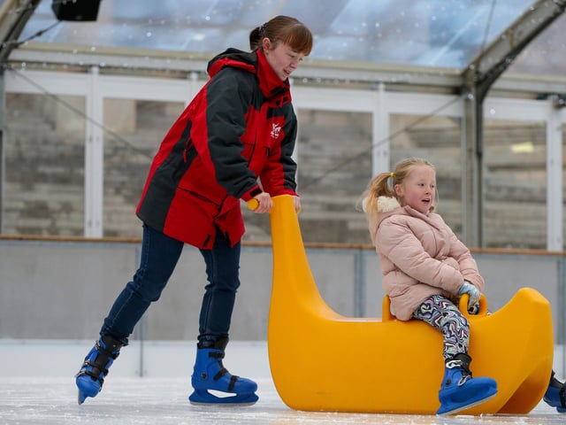 Portsmouth On Ice officially opens, Guildhall Square, Portsmouth Pictured: Emily Kendall and her niece, Evie, 6 Picture: Chris  Moorhouse (231124-18)
