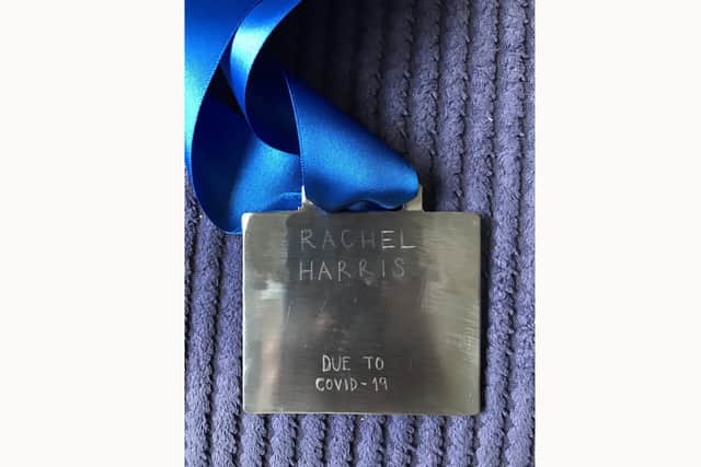 Rachel Harris's friend has created a homemade medal to be awarded - if Rachel completes the race.