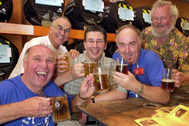 Portsmouth 24th Beer Festival at The Guildhall in 2004, where event organiser Shep Woolley (left) is getting into the spirit with (left to right) Phil Souter, Colin Rowland, beer brewer Brian "Stumpy" Lewis from Hill Head and Bob Batchelor, on the stand of Hampshire beers. Picture: Michael Scaddan 044171-0045