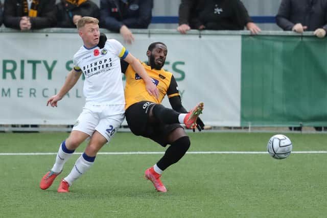 Hawks striker Tommy Wright battles with his former Westleigh Park colleague Roarie Deacon. Picture: Dave Haines
