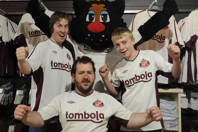David Jackson 21, Lee Crabtree  24, (centre) and Joe Lakeman 14 celebrate with Samson after being first in the City to buy the new Sunderland away strips in 2010.