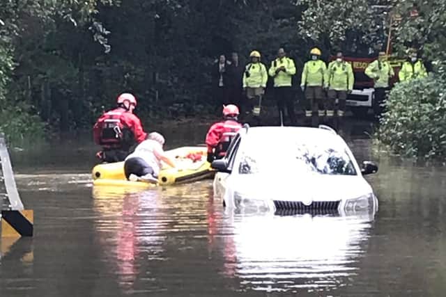 Firefighters help to rescue motorist from water in Hampshire. Picture: Fareham Fire Station via Twitter