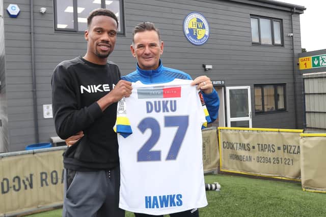 New Hawks signing Manny Duku, left, with boss Paul Doswell Picture: Dave Haines