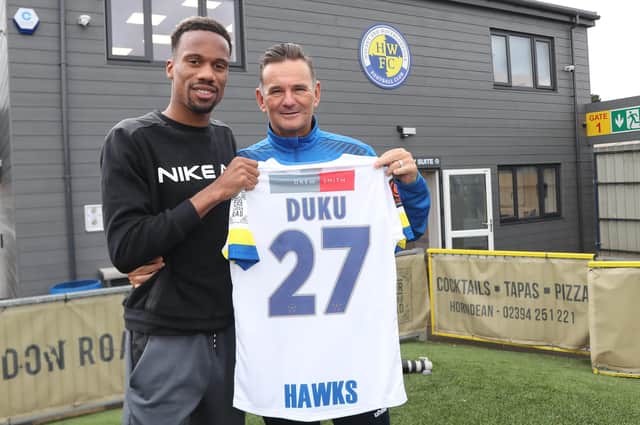 New Hawks signing Manny Duku, left, with boss Paul Doswell Picture: Dave Haines