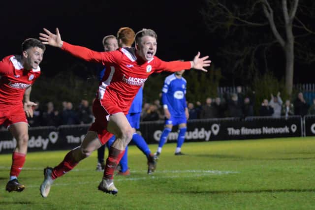 Zack Willett wheels away after scoring Horndean's stoppage time winner against Portland. Picture by Martyn White