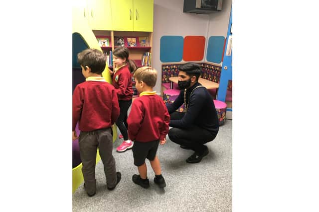 Purbrook Infant School had their parent-funded library opened by Havant mayor Prad Bains. Pictured: Cllr Bains meeting some of the children who will use the library