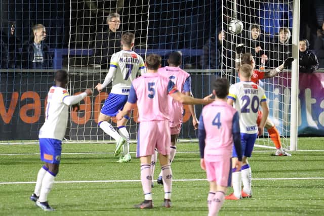 Abdulai Baggie, left, watches a header loop into the Dulwich Hamlet net in midweek. Picture by Dave Haines.