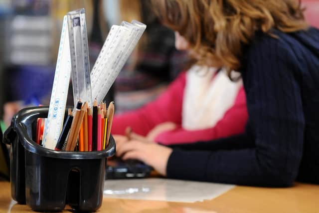Schoolchildren at work in a classroom.