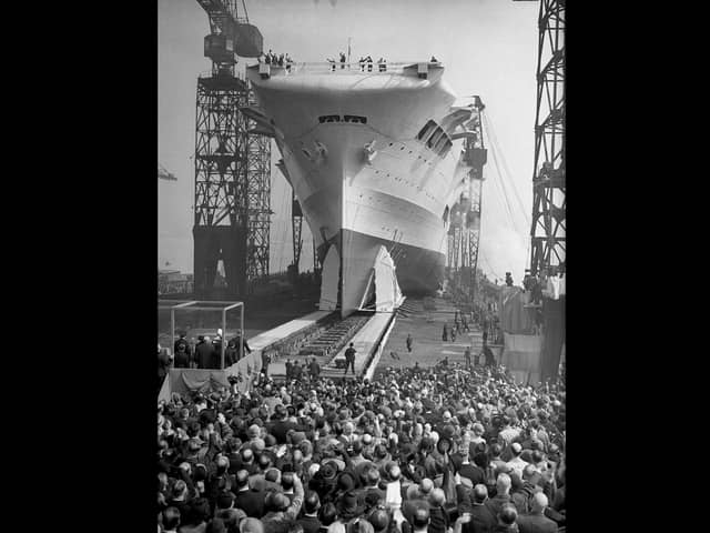 Crowds watch as the 22,000 ton aircraft carrier HMS Ark Royal (91) is launched at the Cammell Laird shipyard in Birkenhead, 13th April 1937. The ship was later sunk off Gibraltar by the German submarine U-81 in November 1941. (Photo by Hudson opical Press Agency/Hulton Archive/Getty Images)