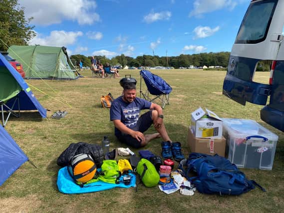 Chris Howard has a 'kit changeover' during his 11,000 mile trek for Children in Need.