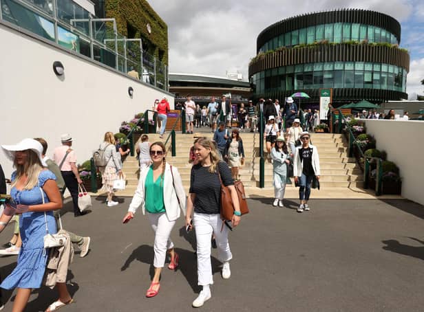 Spectators arrive during Day One of The Championships Wimbledon 2022 at All England Lawn Tennis and Croquet Club on June 27, 2022 in London, England. (Photo by Julian Finney/Getty Images)