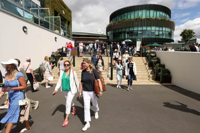 Spectators arrive during Day One of The Championships Wimbledon 2022 at All England Lawn Tennis and Croquet Club on June 27, 2022 in London, England. (Photo by Julian Finney/Getty Images)