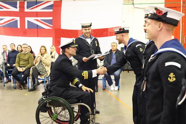 Three-time Olympic Gold medallist Cdr Pete Reed speaking with Air Engineering Technicians at their Pass Out.