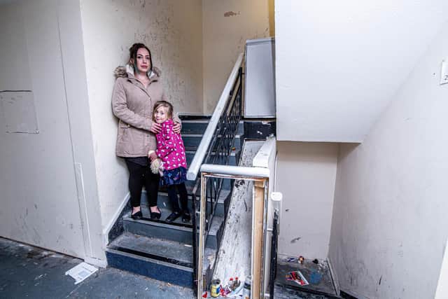 Portsmouth central apartment block, Windsor House in dire state on Wednesday 5 January 2022. Pictured: Leah Hardwick with her daughter, Ayra 5. Picture: Habibur Rahman