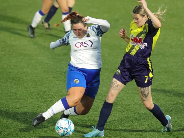 Hawks' Chloe Dark  and Boro's Emily Styler. Picture: Dave Haines