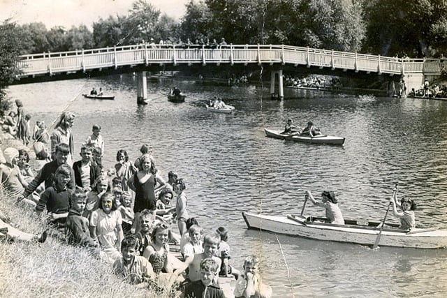 Eileen Mackley in the back of the canoe on the moat at Hilsea Lido