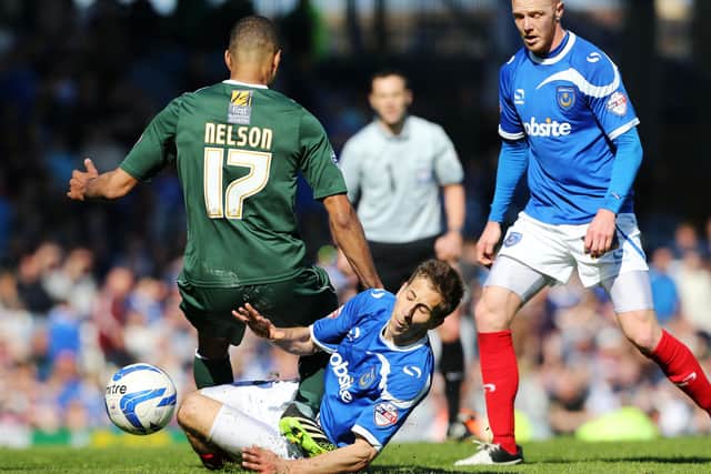 As ever, Wes Fogden in the thick of the action against Plymouth at Fratton Park in May 2014. Picture: Joe Pepler