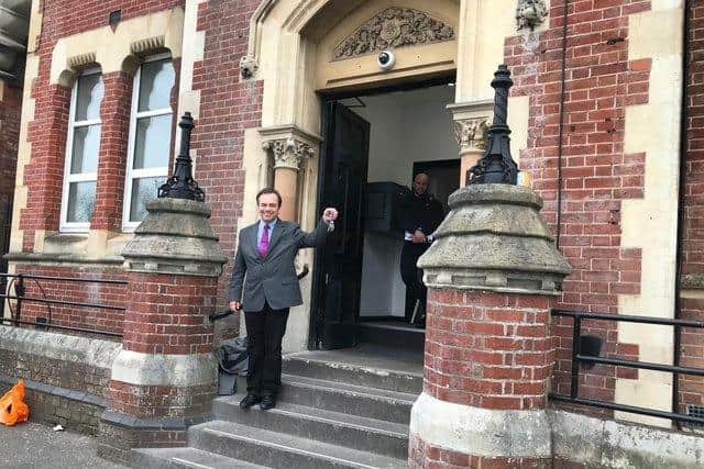 Cllr Darren Sanders celebrating earlier this year as the council acquired three new properties to house homeless people.