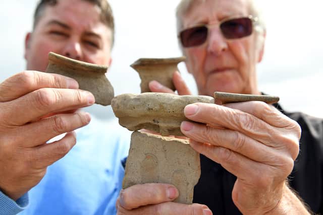 Waterlooville treasure hunters, Lee McGowan (left) and Peter Beasley with items from a previous find. Picture: Malcolm Wells.