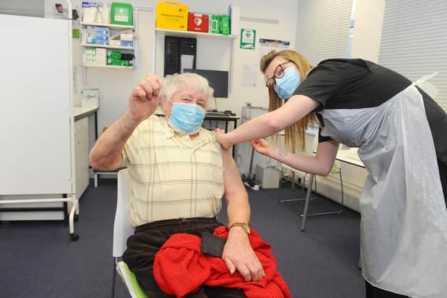 Portsmouth are set to reach 100,000 vaccines given out in the city and The News, Portsmouth, visited Laly's Pharmacy in Guildhall Walk, Portsmouth.
Pictured is: Stephen Arter (81) completes his second Covid-19 vaccination with vaccinator Sophie Furmedge.
Picture: Sarah Standing (220421-7022)