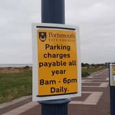 Signs remind visitors that parking charges are now in place all year round