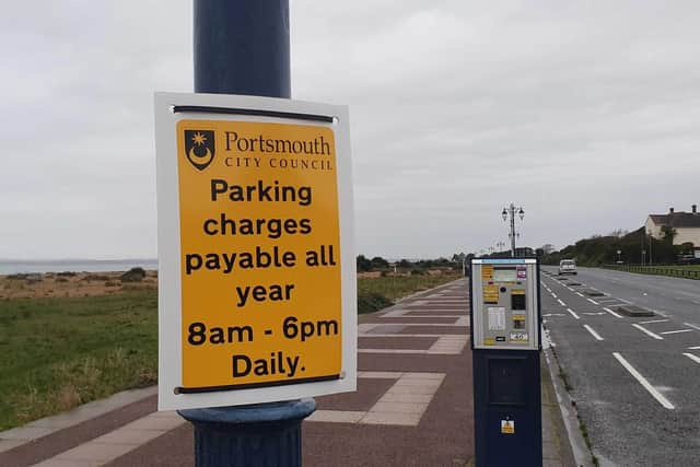 Signs remind visitors that parking charges are now in place all year round