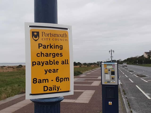 Signs remind visitors that parking charges are now in place all year round