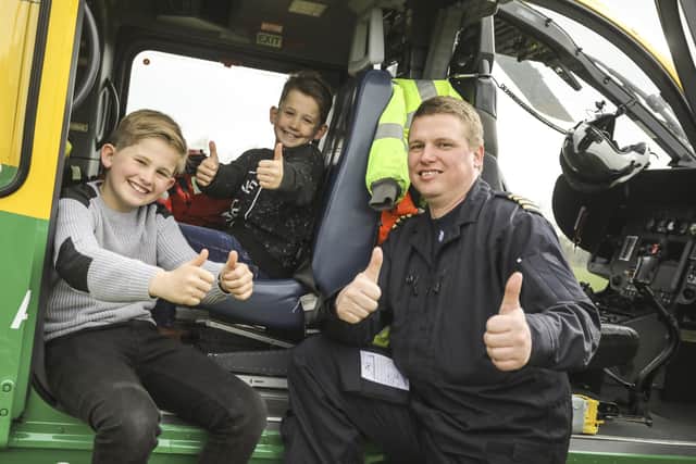 George Copeland (left) with brother Willoughby Copeland and a member of the Hampshire and Isle of Wight Air Ambulance. Pictures: HIOWWA
