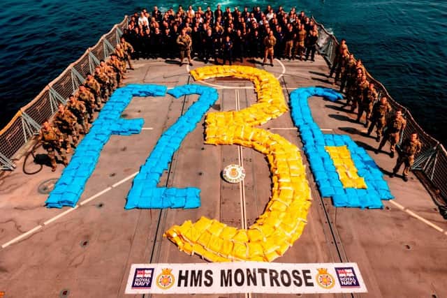 Montrose's ship's company poses with the drugs haul on the flight deck
Picture: Royal Navy